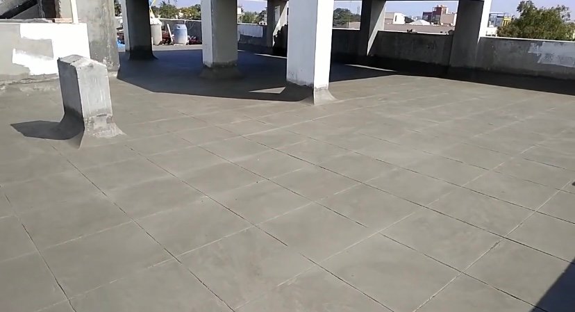 Water stains and cracks on a terrace slab causing roof leakage in a Telangana home
